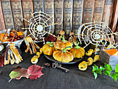 Stuffed mini pumpkin pies, snake-shaped pretzel sticks, chocolate brooms and spider webs for Halloween