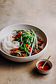 Rice noodles with spicy sauce, chili and marinated ground pork