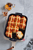 Hot cross buns with sultanas and candied orange peel