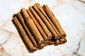 Close up still life brown Ceylon cinnamon sticks\n