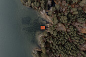 Aerial view roof of fishing hut at lake waterfront, Aviemore, Cairngorms, Scotland\n