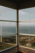 Sunny corner window with ocean view, Rubha Hunish, Isle of Skye, Scotland\n