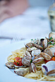 Close up of seafood spaghetti with clams\n