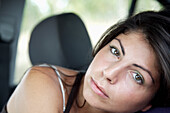 Close up of young woman with green eyes\n