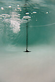 Underwater shot of bathtub filling with water\n