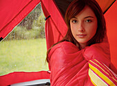 Teenage Girl Camping on a field\n