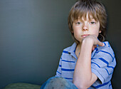 Portrait of a young boy sitting\n