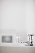 Bathroom sink with chrome taps\n