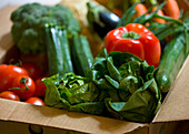 Close up of a box full of organic vegetables\n