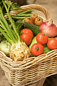 Close up of wicker basket filled with mixed vegetables\n