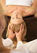 Woman receiving a scalp massage\n
