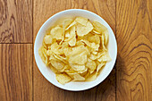 View from above still life bowl of potato chips\n