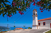 View of church overlooking coastline, sea and hills near Agkonas, Kefalonia, Ionian Islands, Greek Islands, Greece, Europe\n