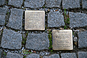 Stolpersteine plaques with names of concentration camp victims embedded in the pavement, Salzburg, Austria, Europe\n