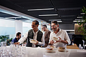 Group of business people during lunch break in office\n