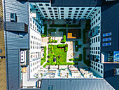 Aerial vie of courtyard surrounded by block of flats\n