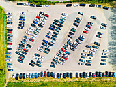 Aerial view of cars in parking lot\n