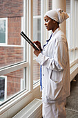 Young female doctor using tablet at work\n