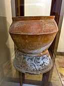 A Mayan ceramic pot in the visitors center museum in the Cahal Pech Archeological Reserve in San Ignacio, Belize.\n