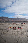 Famara beach (Playa de Famara), 6km golden sand beach located within the Natural Park of the Chinijo Archipelago, between the fishing village of La Caleta de Famara and the base of the impressive cliffs of Famara, Lanzarote, Canary Islands, Spain\n