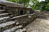 Structure E1 facing Plaza E, the royal residence in the Mayan ruins in the Cahal Pech Archeological Reserve, Belize.\n