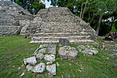Stela 4 & other broken stelae in front of Structure B3 in the Mayan ruins in the Cahal Pech Archeological Reserve, Belize.\n