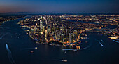 Aerial view of lower Manhattan illuminated at night\n