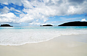 Sea wave on sandy beach at Cinnamon Bay,  Virgin Islands National Park\n