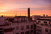 Spain, Seville, Modern skyscraper and old town architecture at sunset\n