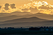 USA, Idaho, Bellevue, Clouds above mountains at sunset\n