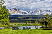 USA, Idaho, Stanley, Scenic landscape with pond and Sawtooth Mountains\n