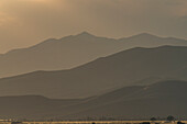 USA, Idaho, Bellevue, Mountain landscape in fog at sunset\n