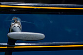 Detail of the original door handle a restored vintage 1927 Chevrolet Series AA Capitol sedan in a car show in Moab, Utah.\n