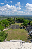 View of pyramids in Plazas A1 & A2 from the top of El Castillo, Structure 6, in the Xunantunich Archeological Reserve in Belize.\n