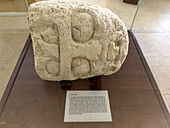 A carved limestone sculpture of Kinich Ahau, the Mayan sun god, in the museum in the Xunantunich Archeological Reserve in Belize.\n