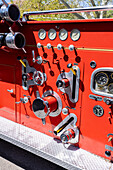 Detail of controls & gauges on a 1948 Series 700 American LaFrance fire engine pumper truck in a car show in Moab, Utah.\n
