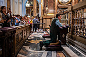 Believers inside the Cathedral-Basilica of Our Lady of the Pillar during The Offering of Flowers to the Virgen del Pilar, the most important and popular event of the Fiestas del Pilar held on Hispanic Day, Zaragoza, Spain\n