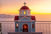 View of miniature Greek Orthodox church on coastal road near Assos, Kefalonia, Ionian Islands, Greek Islands, Greece, Europe\n