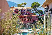 View of balcony and colourful houses in Assos, Assos, Kefalonia, Ionian Islands, Greek Islands, Greece, Europe\n