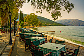 View of taverna tables at Karavomilos Lake in Sami, Sami, Kefalonia, Ionian Islands, Greek Islands, Greece, Europe\n