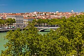 France, Rhone, Lyon, historical site listed as World Heritage by UNESCO, Rhone River banks with a view of the Croix-Rousse District and Wilson bridge\n