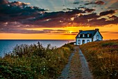 France, Finistere, Cap Sizun, Beuzec Cap Sizun, Pointe du Millier, Millier lighthouse at sunset\n