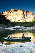 France, Ardeche, Ardeche Gorges National Natural Reserve, Sauze, a gard of the natural reserve makes its morning watch on a canoe in the Ardeche canyon\n