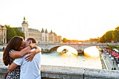 France, Paris, area listed as World Heritage by UNESCO, Lovers on the Notre-Dame Bridge\n