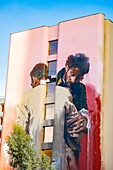 France, Paris, 13th arrondissement, Street Art, 85 Boulevard Vincent Auriol building, © Conor Harrington, fresco Embrace and Struggle\n