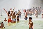 France, Paris, area listed as World Heritage by UNESCO, the Trocadero gardens during hot days, bathing and water cannon\n