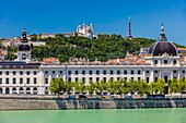 France, Rhone, Lyon, historical site listed as World Heritage by UNESCO, Rhone River banks with a view of the Hotel Dieu and Notre Dame de Fourviere Basilica\n