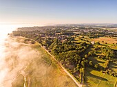 France, Somme, Somme Bay, Saint-Valery-sur-Somme, Cape Hornu and the channel of the Somme in the morning mist (aerial view)\n
