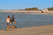 France, Somme, Baie de Somme, Le Hourdel, couple walking on the beach at Hourdel Bay Somme\n