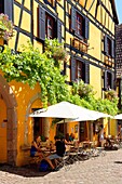 France, Haut Rhin, Alsace Wine Route, Riquewihr, labelled Les Plus Beaux Villages de France (The Most Beautiful Villages of France), rue de Gaulle, traditionals half timbered houses\n